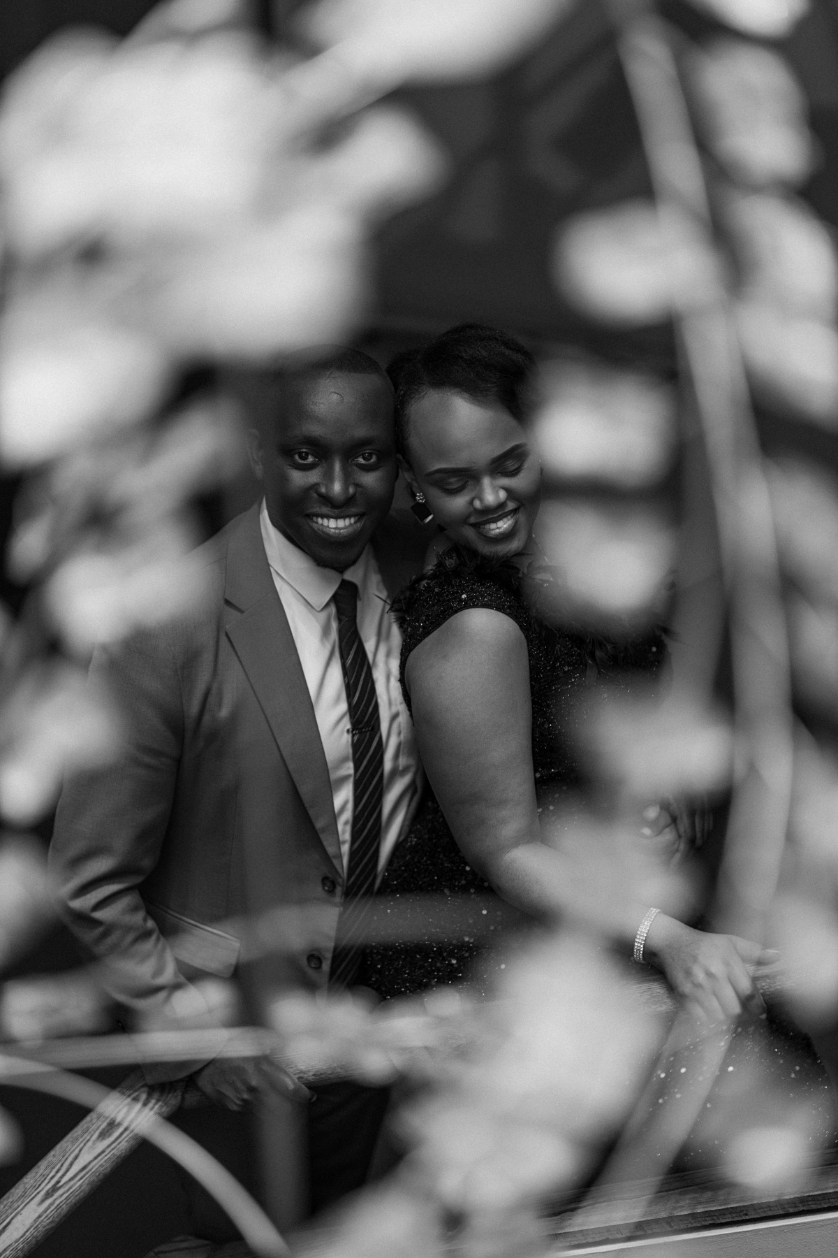 Hope and Arsene, a tender black-and-white portrait framed by blossoms